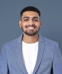 Cheerful Indian businessman smiling closeup portrait for jobs and career campaign